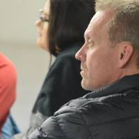 Photo of audience member looking ahead